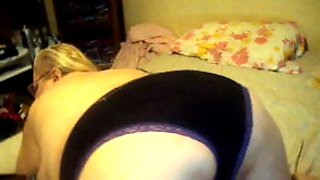 Striping off new black panties 