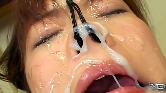 Cute Asian babe with gag in mouth gets sperm