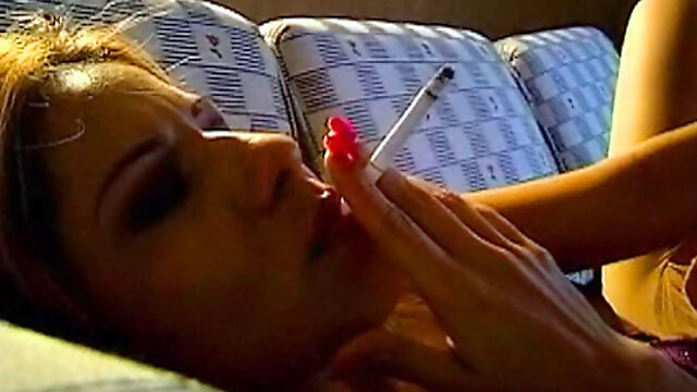 Close up on sexy girl blowing smoke