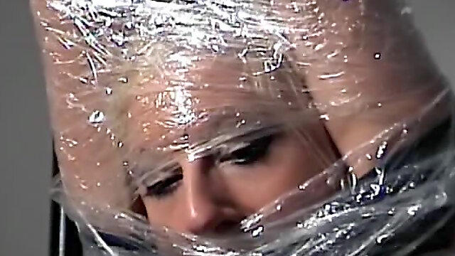 Cute girl bound in plastic wrap