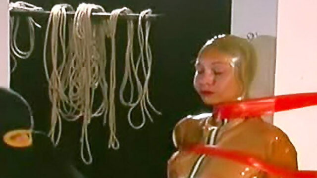 Rubber girl bound by ropes