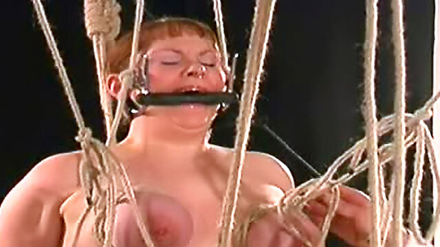 Titty torture of a girl in leather corset