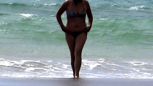 My mature wife shows off and enjoys the beach with her lover