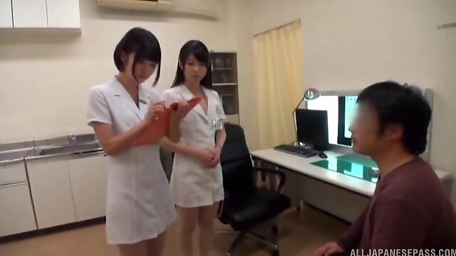 Lucky man gets his dick jerked off by two kinky Japanese nurses