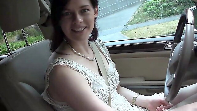 Pretty brunette masturbates in the car during driving