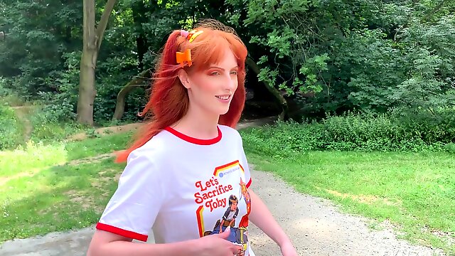 Redhead teen Alex Harper with pigtails does a photoshoot in the woods