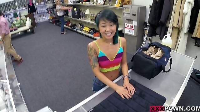 Tattooed Asian hottie goes in a pawn shop for a fuck