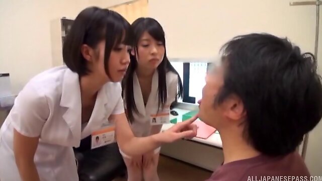 Nerdy guy gets his dong jerked off by horny Asian sluts in the office