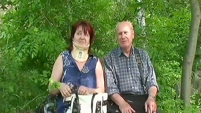 Chubby granny in a neck brace fucks her husband by the lake