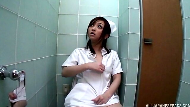 Nurse sneaks into the bathroom to masturbate with a vibrator