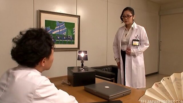 In the office a Japanese doctor fucked by two of her assistants