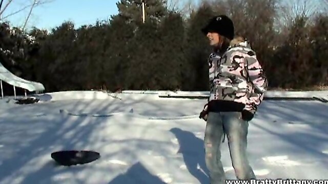 Britney Spring plays in the snow in some very tight jeans