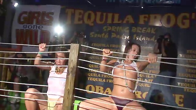 Drunk girls get topless during a wet t-shirt contest