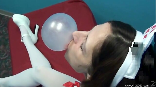 Horny Nurse MILF In Her Hot Uniform Makes Bubbles With Her Gum