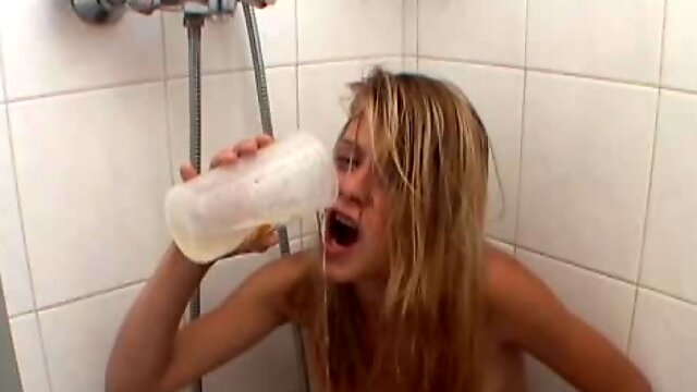 Filthy blonde drinks guys pee and toys her ass