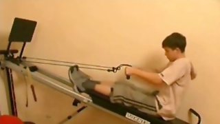 Mom helps boy workout