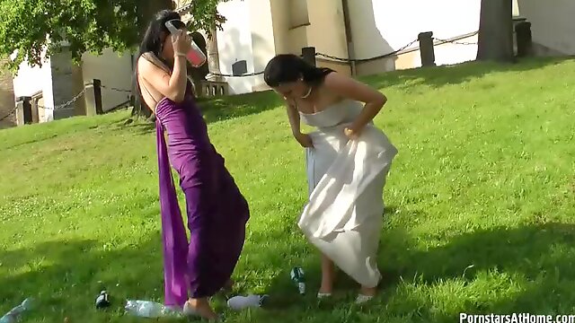 Bride and Maid of Honor Getting Wet With Champagne On The Wedding Day