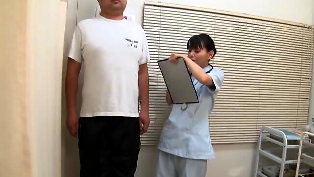 Japanese nurse enjoys while having clothed sex with her patient