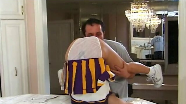 Gorgeous young cheerleader fucks in the kitchen and gets a mouthful of cum