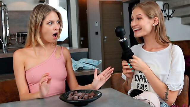 Rebecca Volpetti and Tiffany Tatum are playing with a toy