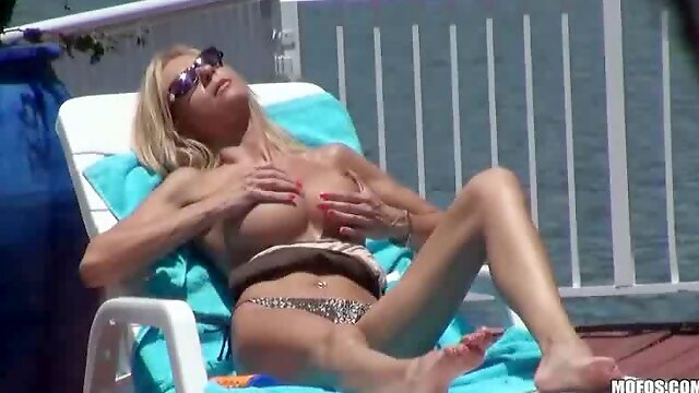 Big tits milf spied on while sunbathing