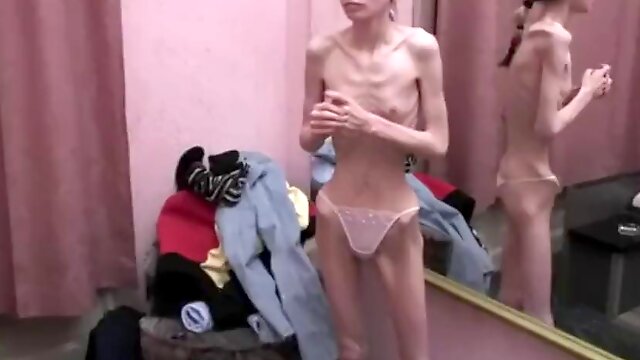 Extremely anorexic brunette girl Janine displays her body all alone