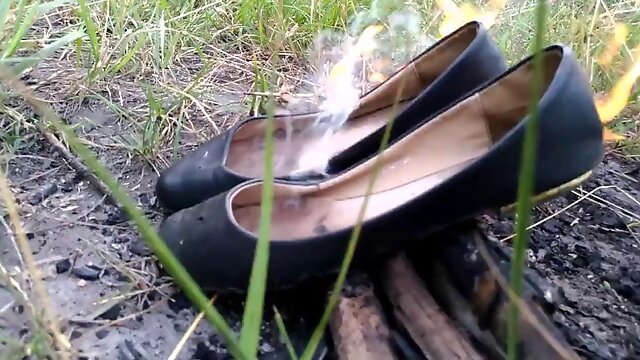 Wife burning her old flats and tights and me stomp on ashes.