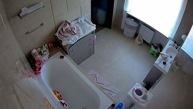 Bathroom voyeur spy of a hot MILF