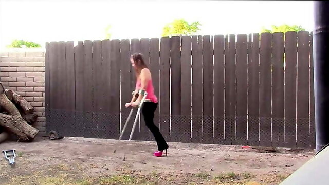 Amputee Brittney using high heel and crutch