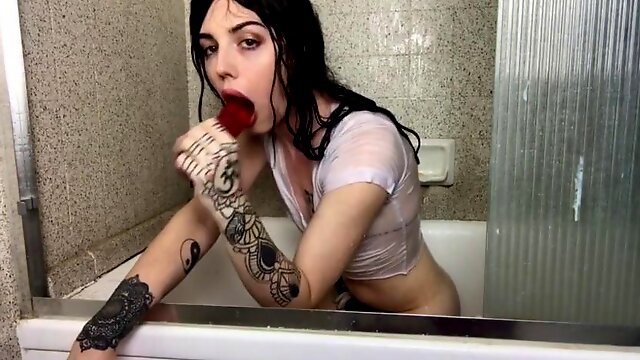 Fit shemale fucks her ass with dildo in the bathroom