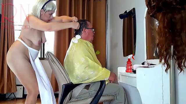 Nudist barbershop. Nude lady hairdresser in an apron. The client is surprised. 2. 1