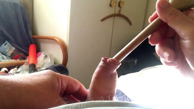 Sunday foreskin - opening up with wooden spoon