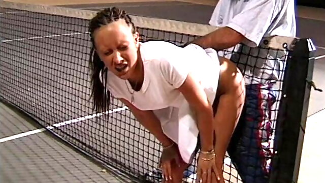 Young cute brunette with dreadlocks takes some lessons of tennis with lusty coach