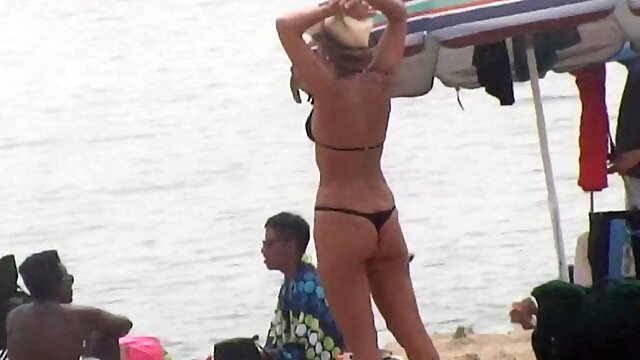 Hot curvy MILF on the beach