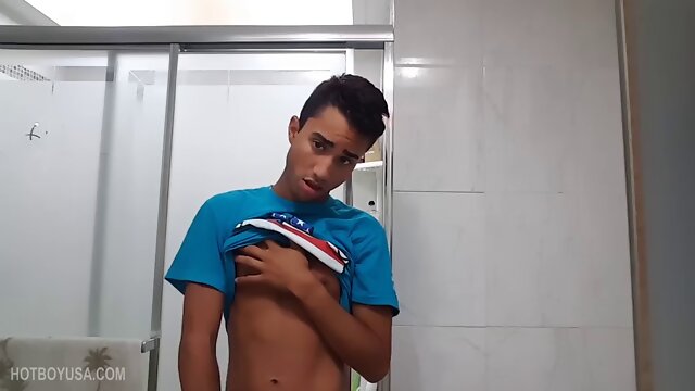 Tiny Lucas Prescott is jerking off in the bathroom, and once again we have the pleasure of watching this Latin twink stroke his monster uncut. At first he gets up to give us great profiles of his huge cock.