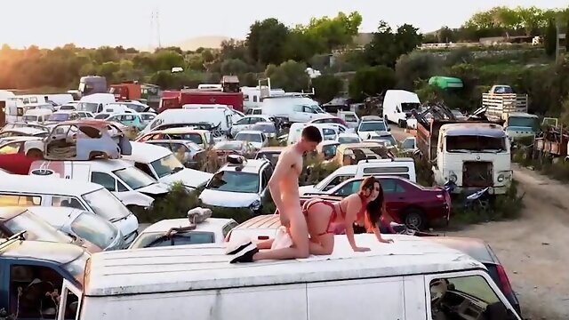 Nymph in sexy lingerie screwed by stud in abandoned junkyard