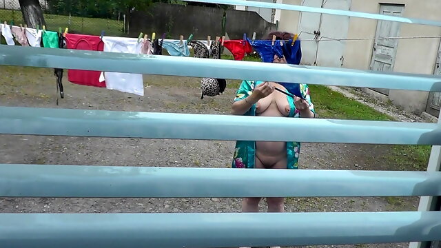 Naked in public. Neighbor saw pregnant neighbor in window who was drying clothes in yard without bra and panties. Nudist