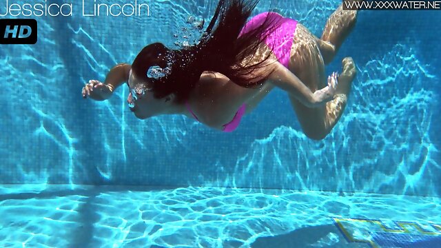 Jessica Lincoln in her pink bikini in the pool