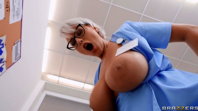 Short-haired nurse in glasses fucks young Spanish dude