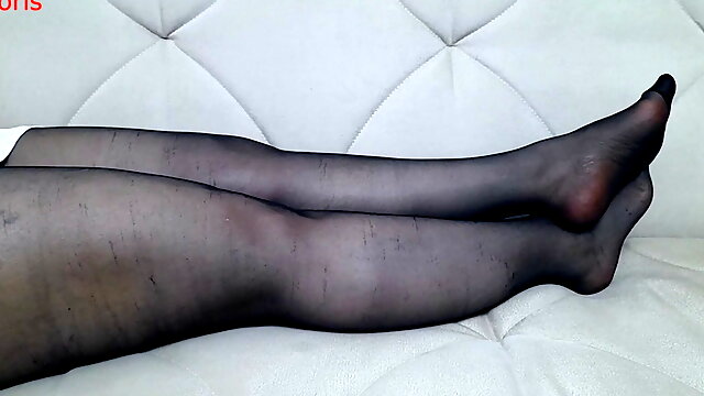 From another point of view, Anna's black pantyhose, legs and feet.