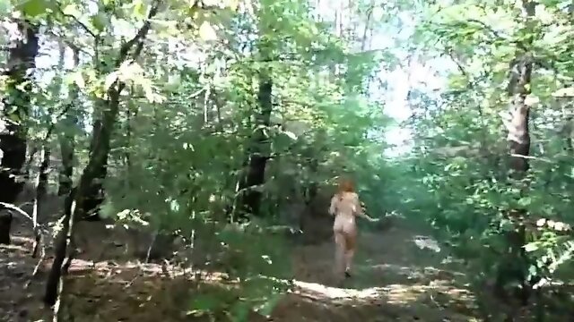 Chubby girl with big booty walking nude in forest