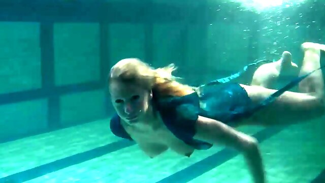 Blonde Feher with big firm tits underwater