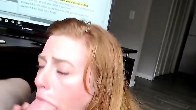 Innocent looking redhead gives blowjob on her knees in POV