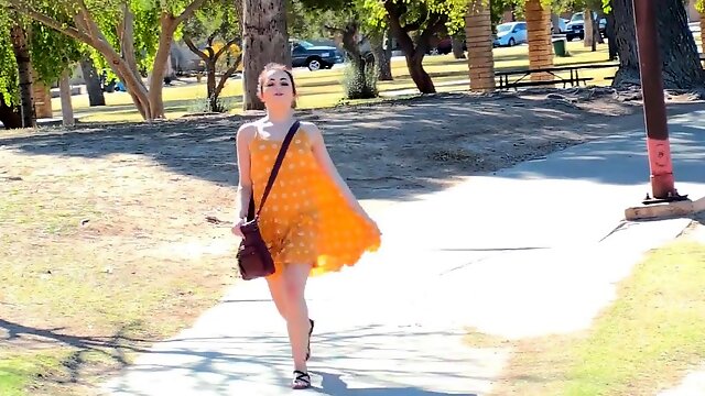 Babe in yellow dress is masturbating outdoors