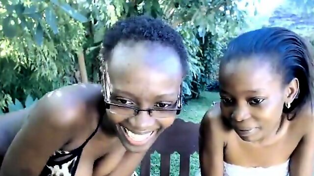 Two dark skinned cuties showing off their sexy bodies in th