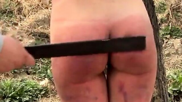 Tied to a tree and severely spanked