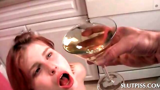 Teen redhead drinking her own hot piss in close-up