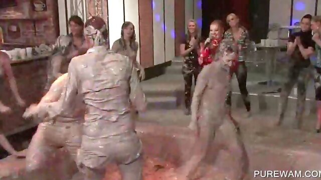 Dirty party babes have fun fighting in messy mud at orgy