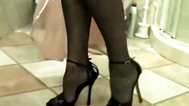 Wife in nylon stockings teasing with her high heel sandals