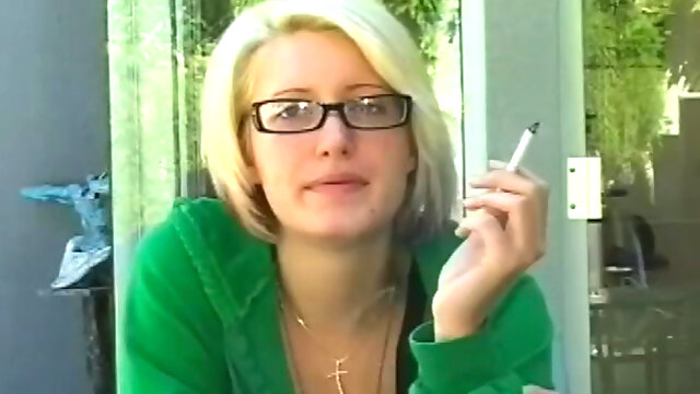 Sexy blonde likes smoking and teasing